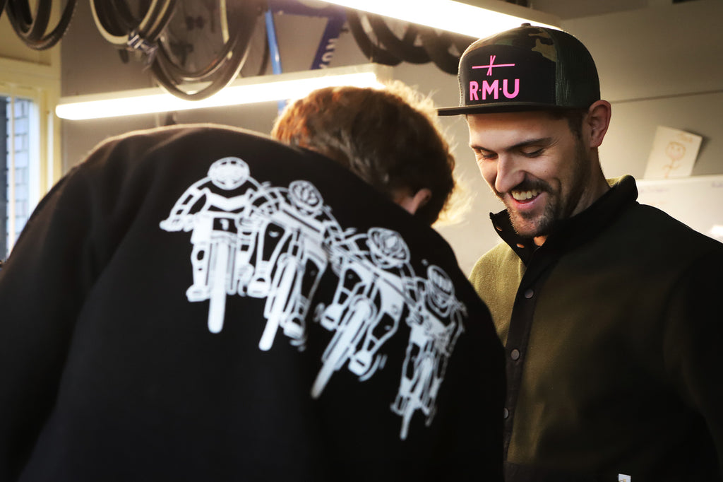 two men talking and laughing