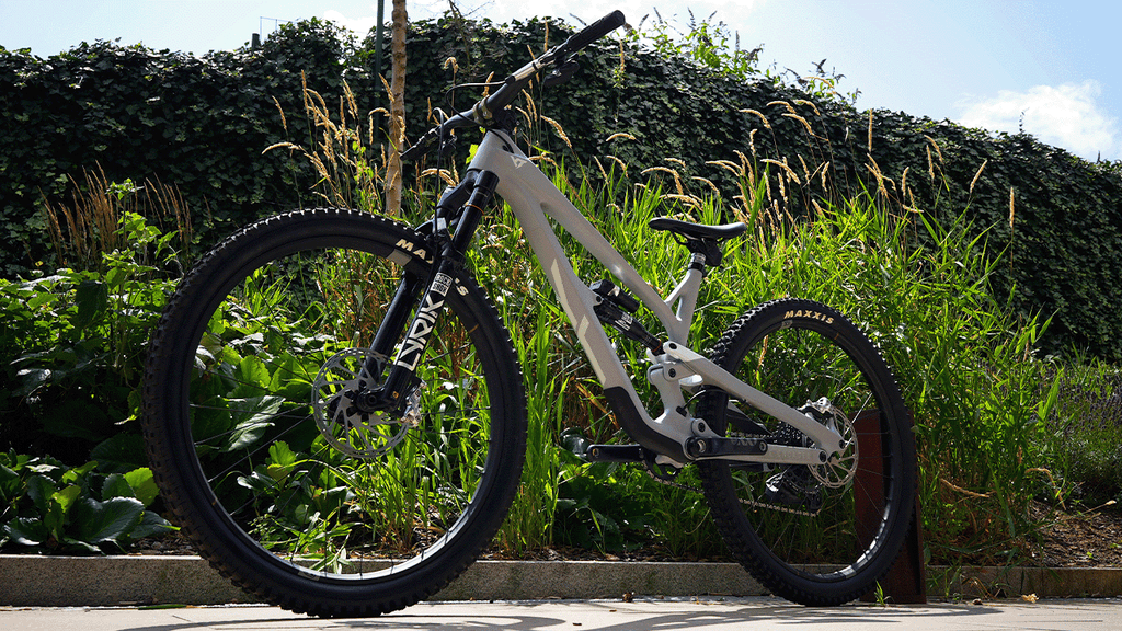 a YT mtb stood up against a nature background